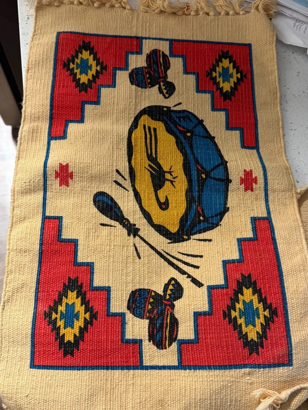 Handwoven Drum Motif Wall Tapestry in Red, Blue, Yellow